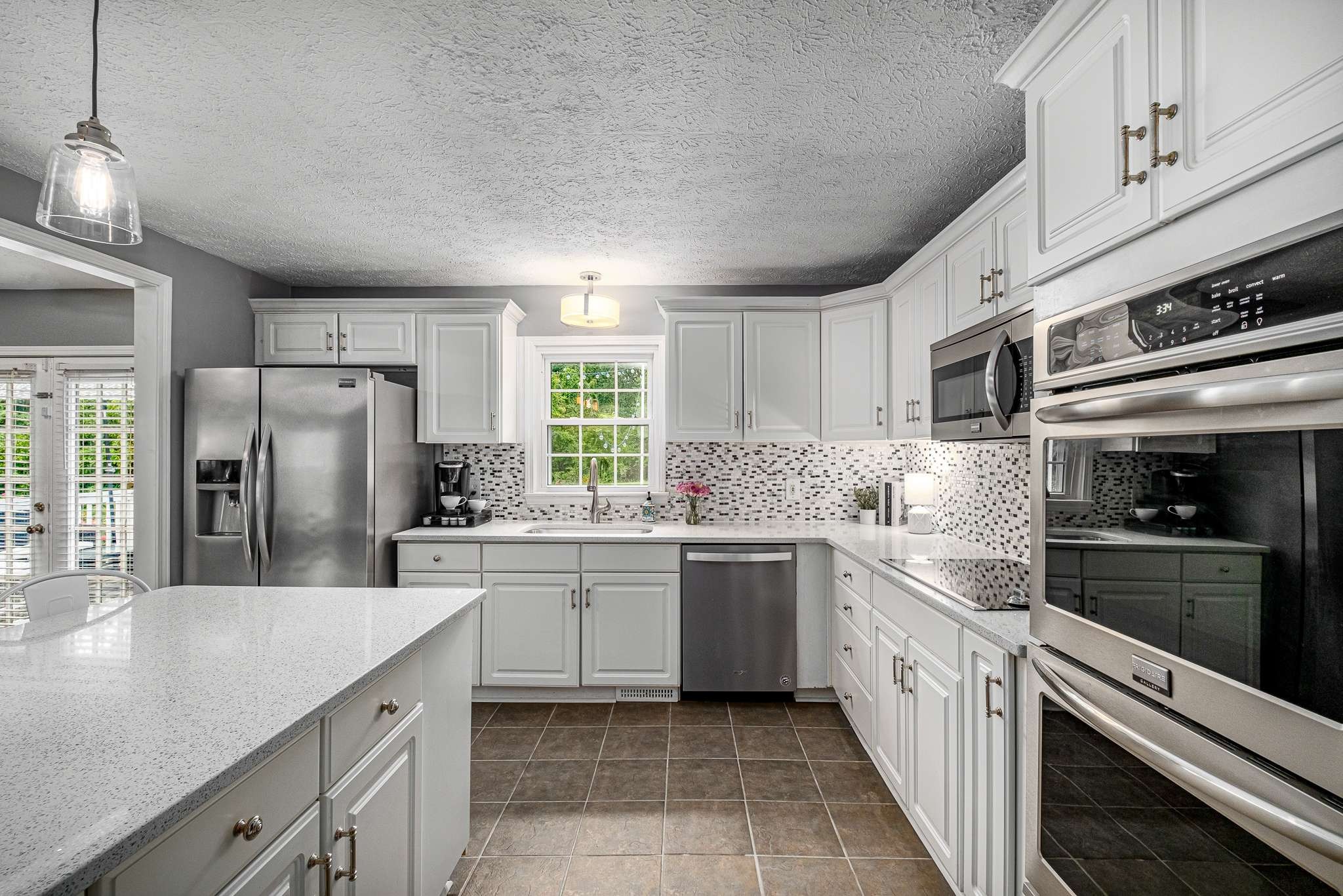 2144 Osburn Road Arrington, TN 37014 - Photo 21 of 51 a kitchen with stainless steel appliances granite countertop a sink and dishwasher a refrigerator with wooden cabinets