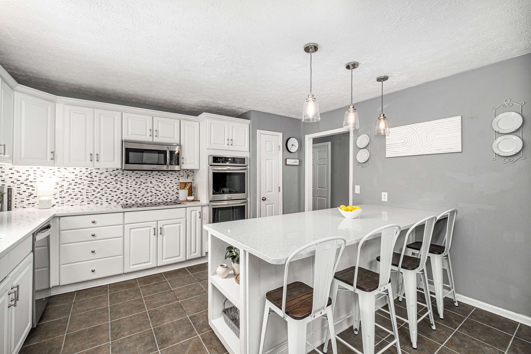 2144 Osburn Road Arrington, TN 37014 - Photo 22 of 51 a kitchen with stainless steel appliances kitchen island granite countertop a stove a sink dishwasher and a refrigerator with wooden floor