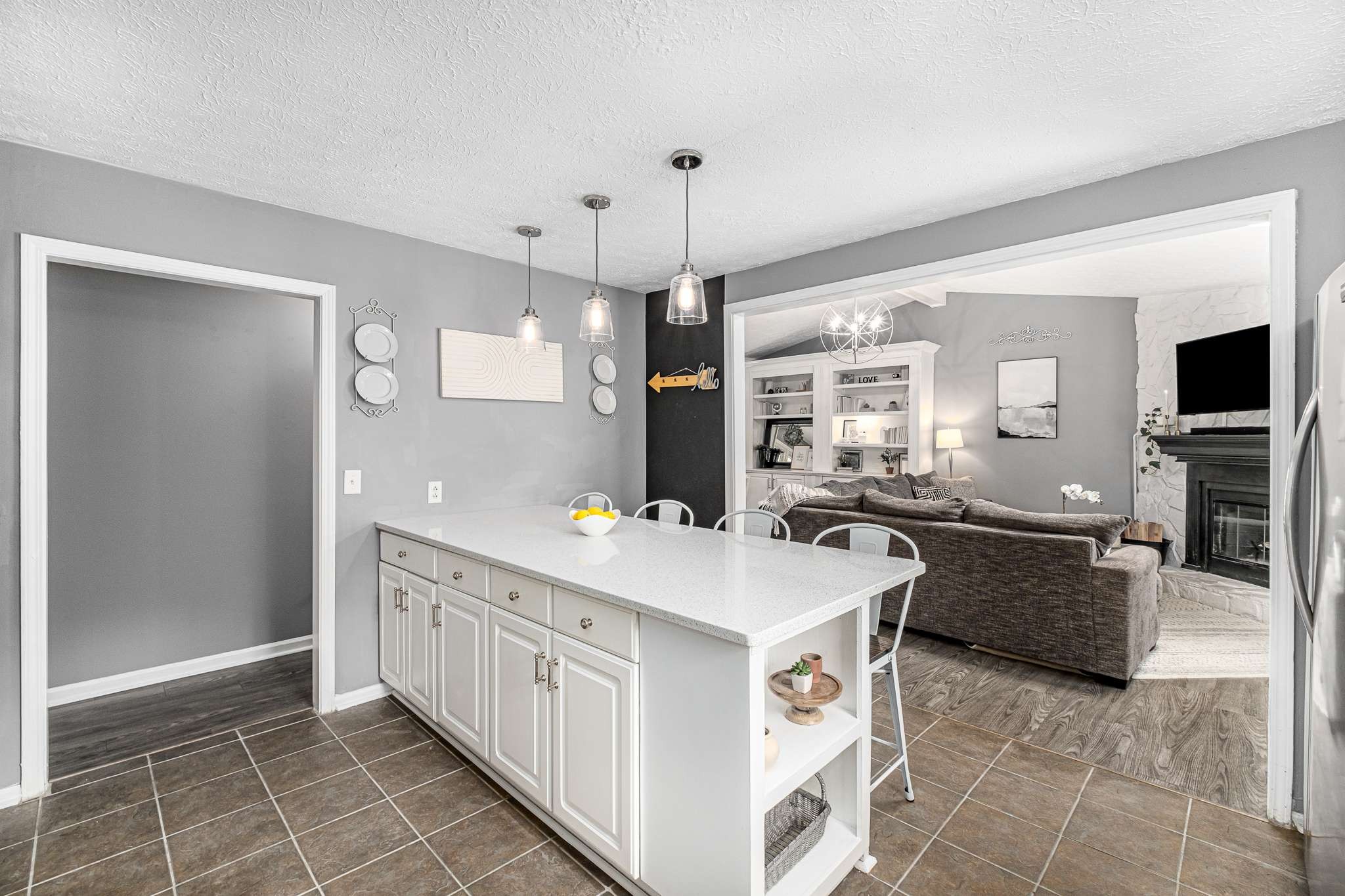 2144 Osburn Road Arrington, TN 37014 - Photo 24 of 51 a kitchen with a stove a sink a refrigerator and chairs