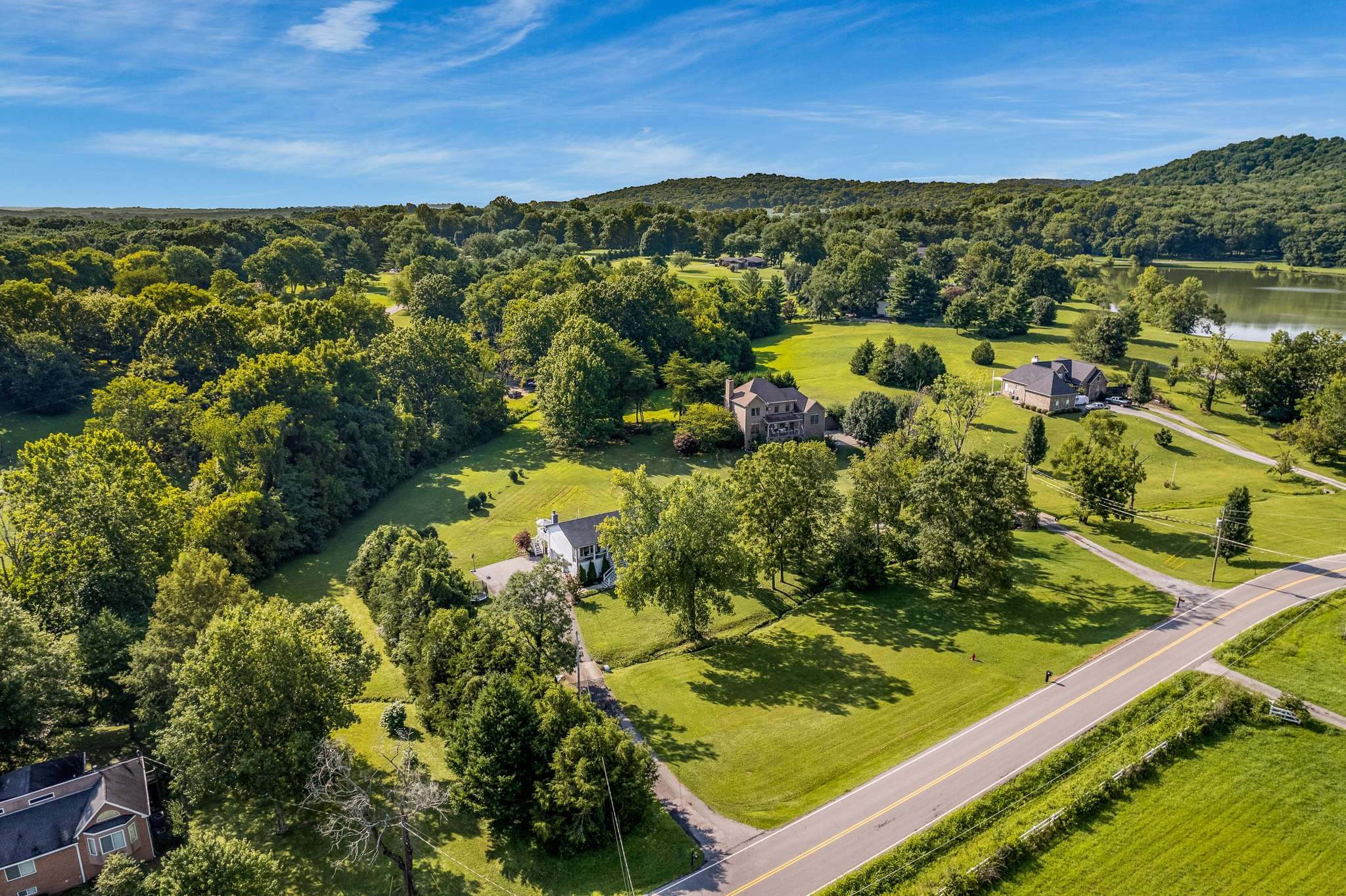 2144 Osburn Road Arrington, TN 37014 - Photo 4 of 51 a view of a lake with a mountain in the background