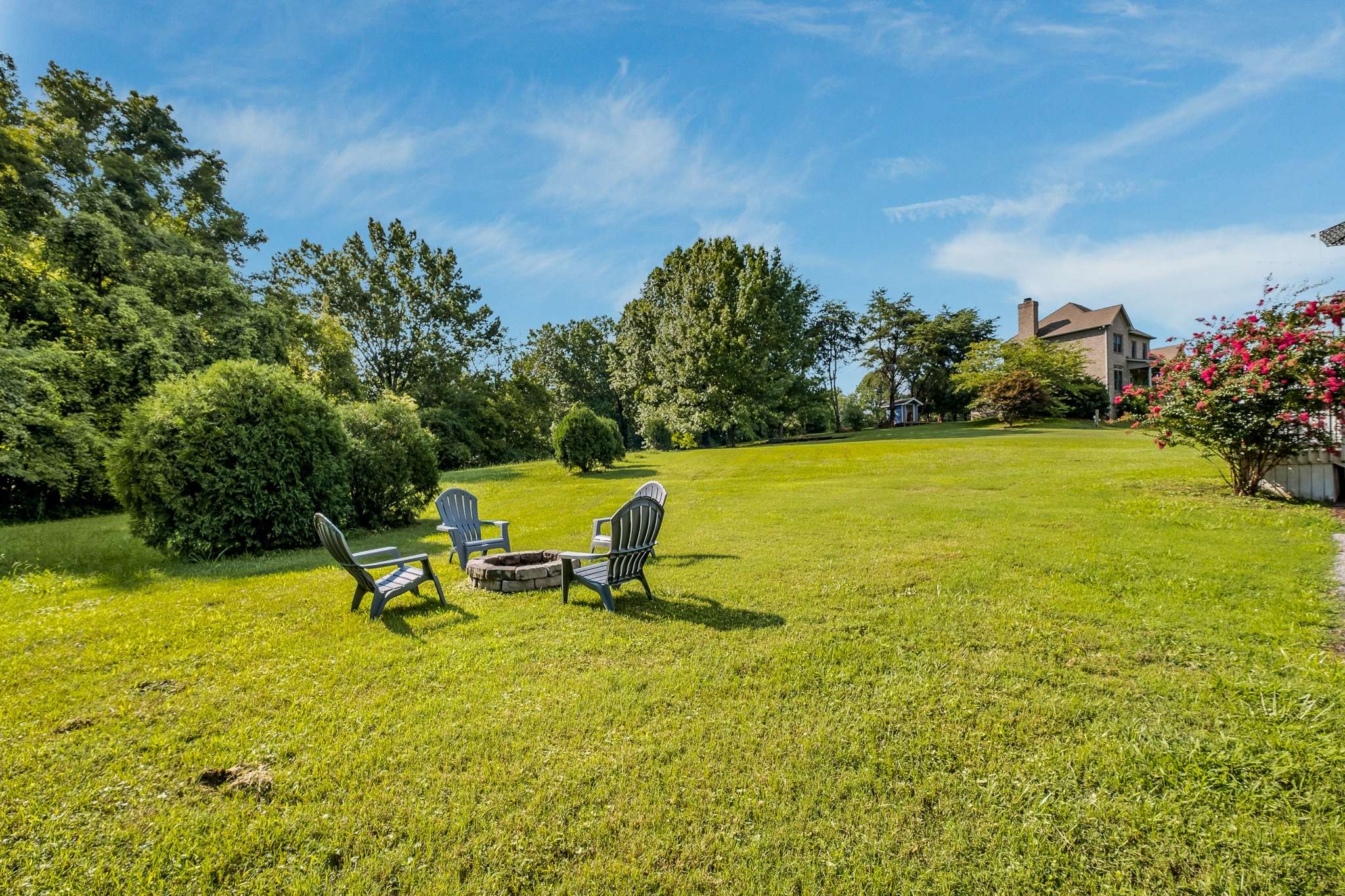 2144 Osburn Road Arrington, TN 37014 - Photo 45 of 51 a view of a lake with a bench in the background
