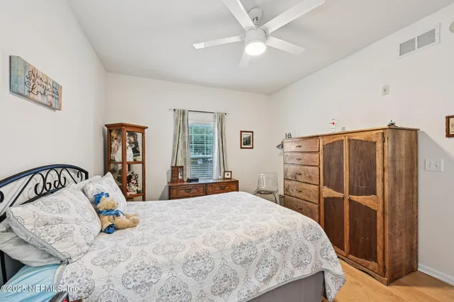 a bed room with a bed and dresser