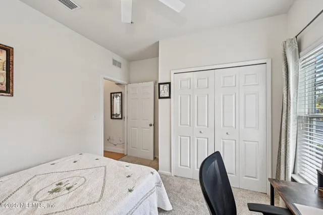 a bathroom with a sink a window and a mirror