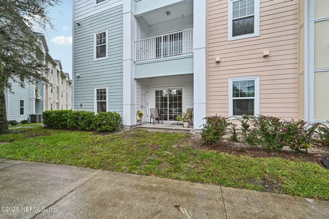 a view of a house with garden and plants