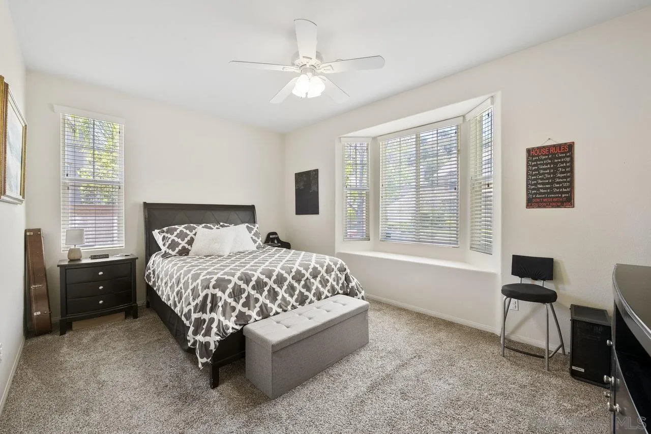 2928 Burnet Drive Escondido, CA 92027 - Photo 13 of 39 a bedroom with a bed chair and window