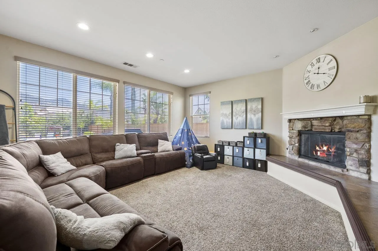 2928 Burnet Drive Escondido, CA 92027 - Photo 14 of 39 a living room with furniture and a fireplace