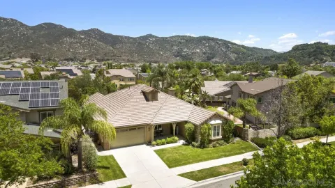 an aerial view of house with yard