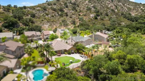 an aerial view of residential houses with outdoor space