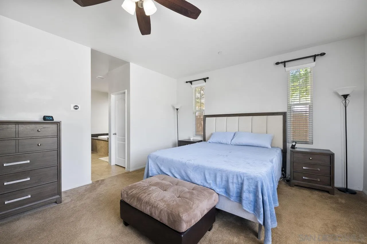 2928 Burnet Drive Escondido, CA 92027 - Photo 7 of 39 a bedroom with a bed and a cabinets