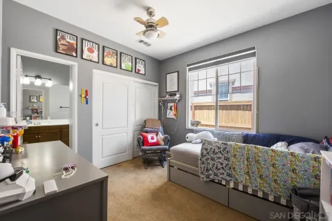 a bedroom with bed and a window