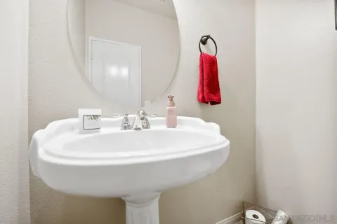a bathroom with a sink and mirror