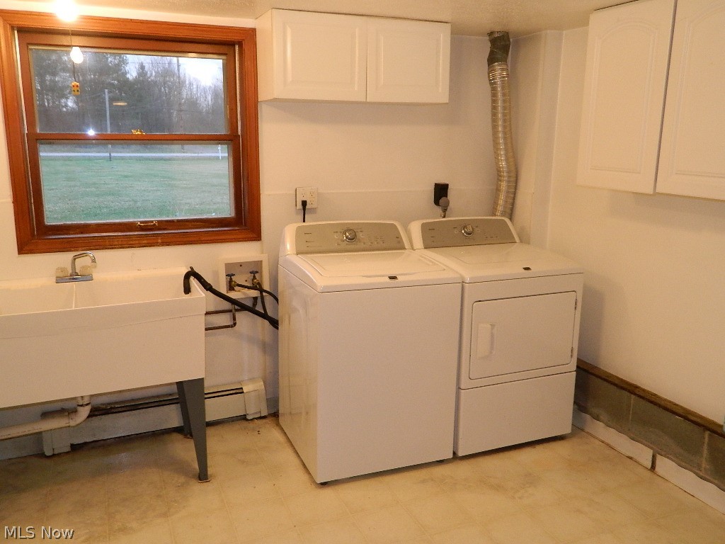 9284 Mayfield Road Chesterland, OH 44026 - Photo 13 of 33 First Floor Laundry Room with Double Sinks and Cabinetry - A Great Size!