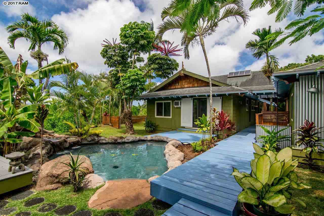 690 East Kuiaha Road Haiku, HI 96708 - Photo 1 of 30 a view of a house with swimming pool and sitting area