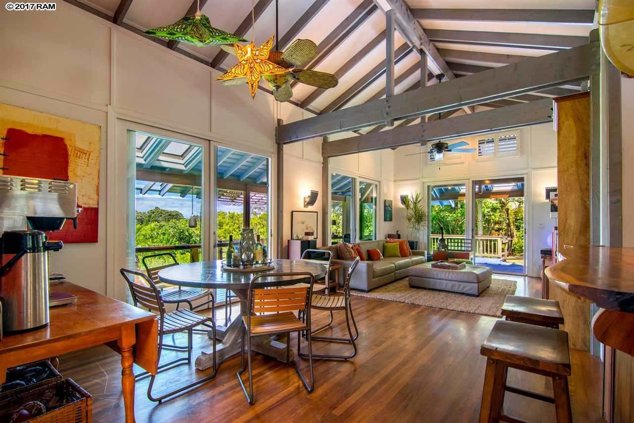 690 East Kuiaha Road Haiku, HI 96708 - Photo 6 of 30 a living room with furniture a wooden floor and a large window