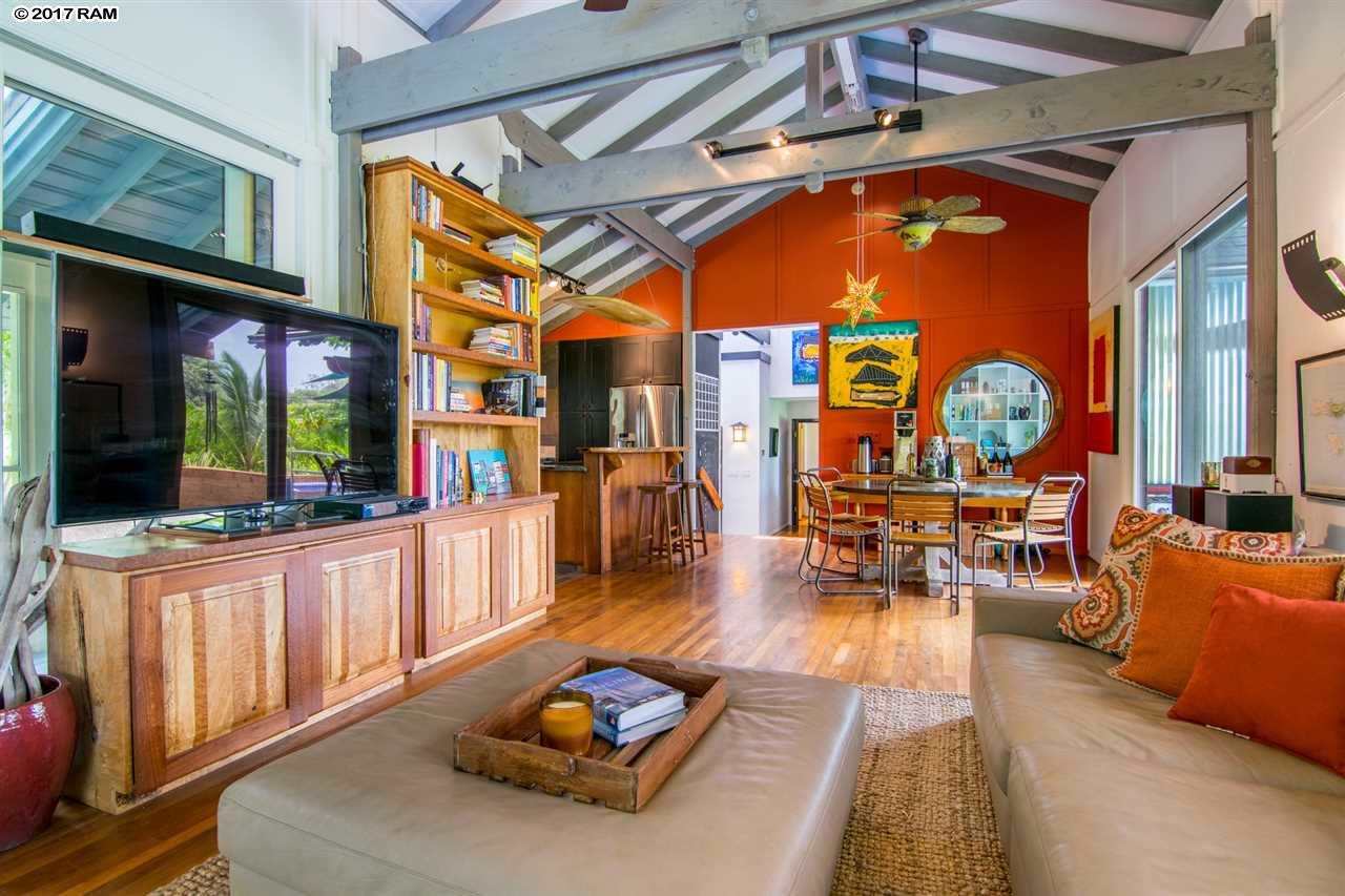 690 East Kuiaha Road Haiku, HI 96708 - Photo 10 of 30 a living room with furniture a chandelier and a fireplace