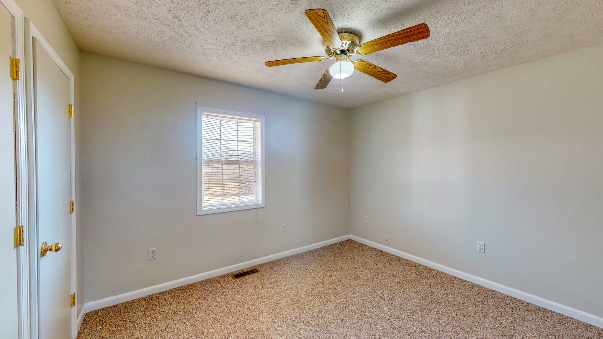 2008 Gin Branch Road Cedar Grove, TN 38321 - Photo 20 of 28 an empty room with a window and a ceiling fan