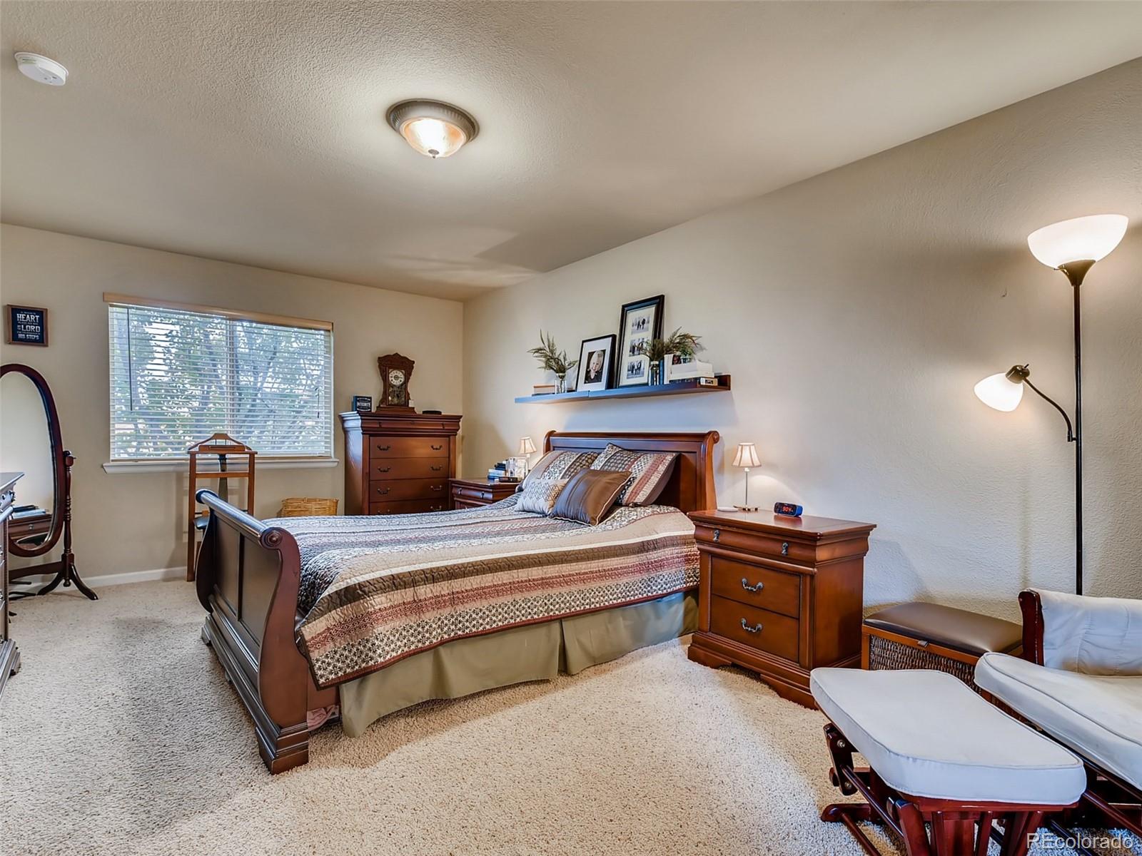 8209 County Road 2 Brighton, CO 80603 - Photo 21 of 40 a bedroom with double bed and a night stand