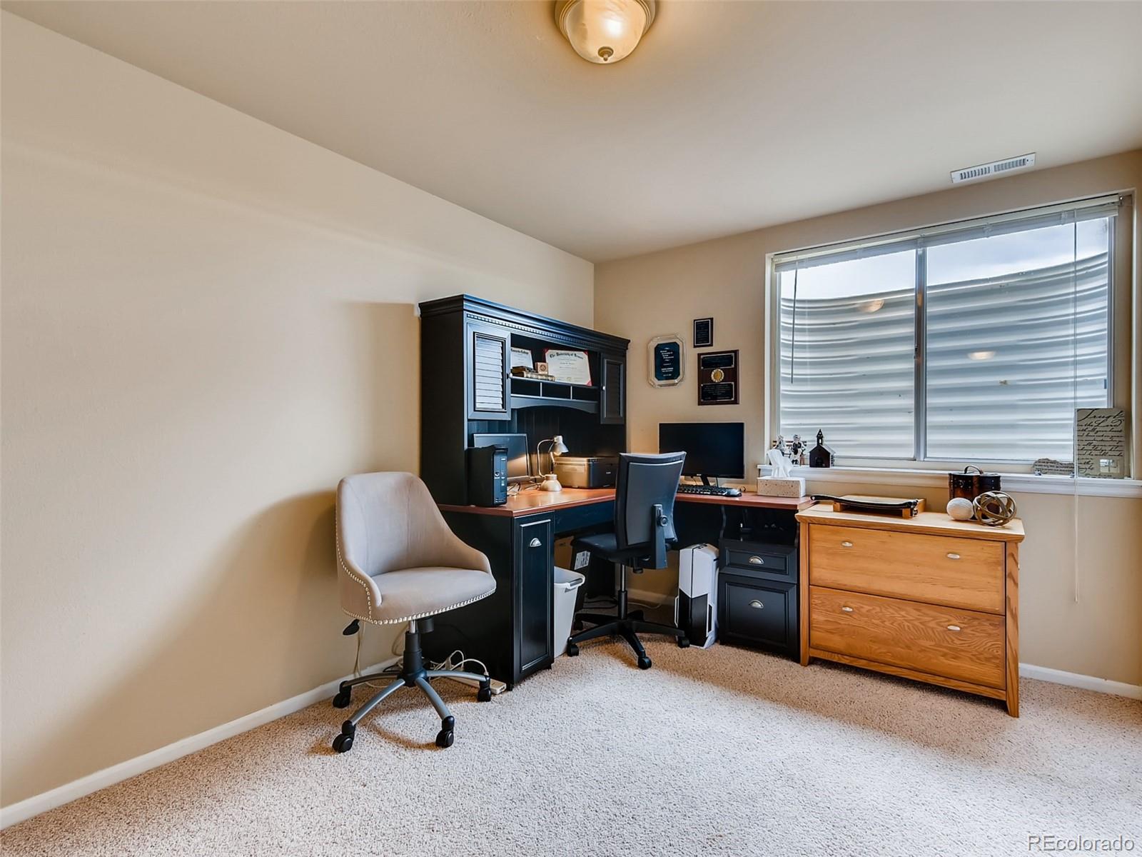 8209 County Road 2 Brighton, CO 80603 - Photo 30 of 40 a view of a workspace with furniture and a window