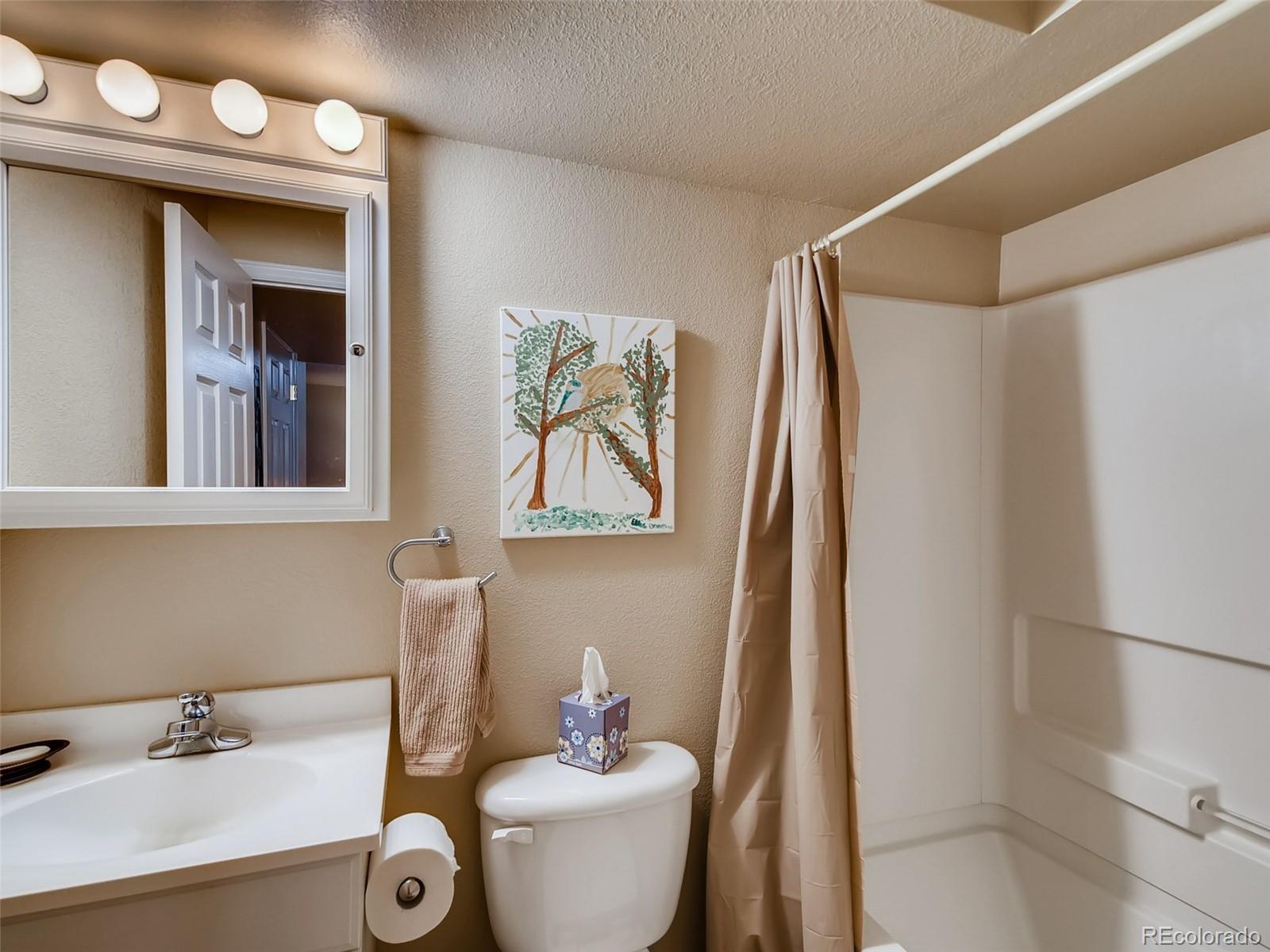 8209 County Road 2 Brighton, CO 80603 - Photo 32 of 40 a bathroom with a sink mirror and toilet