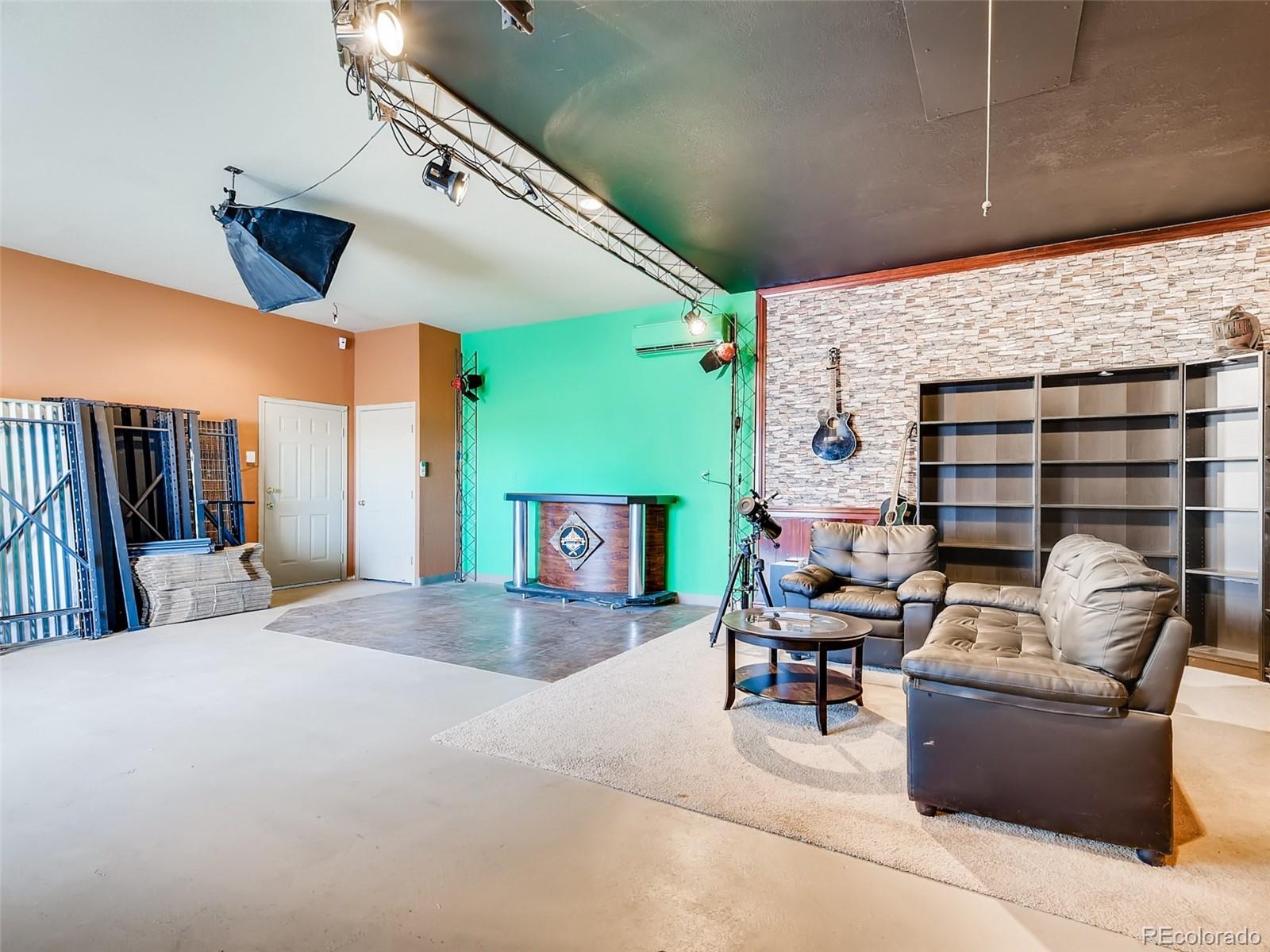8209 County Road 2 Brighton, CO 80603 - Photo 36 of 40 a living room with furniture and a flat screen tv