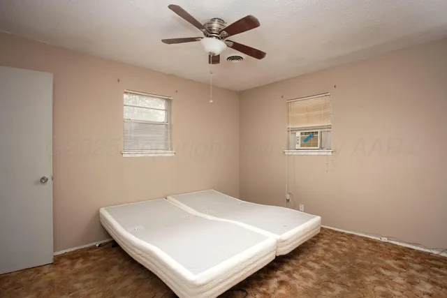 a white bed in a white room