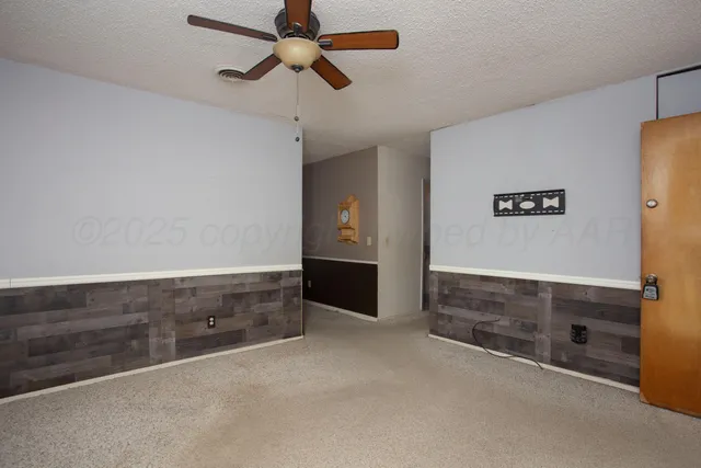 a view of closet area with empty racks