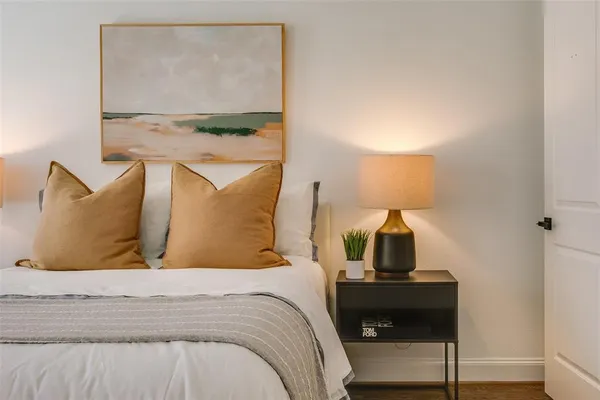 a bedroom with a bed and window