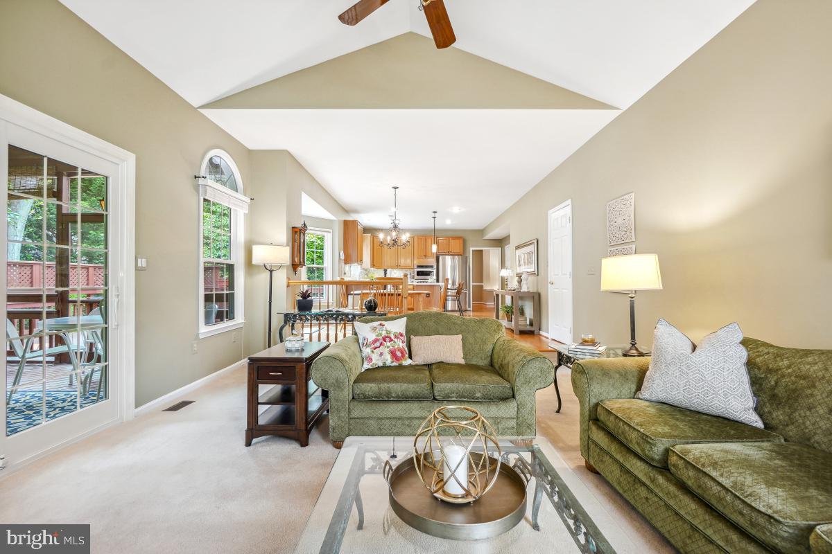 20479 Quarterpath Trace Circle Sterling, VA 20165 - Photo 18 of 41 a living room with furniture and a lamp