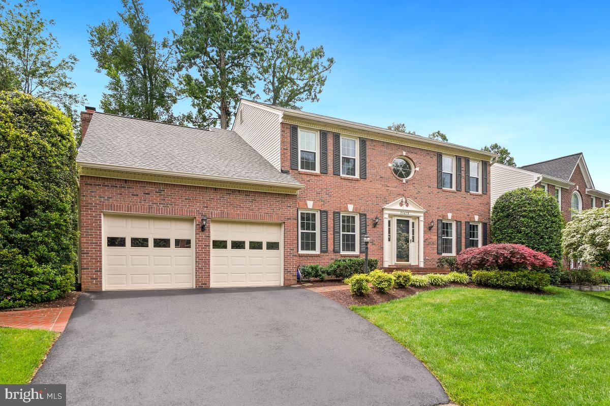 20479 Quarterpath Trace Circle Sterling, VA 20165 - Photo 2 of 41 a house view with a garden space