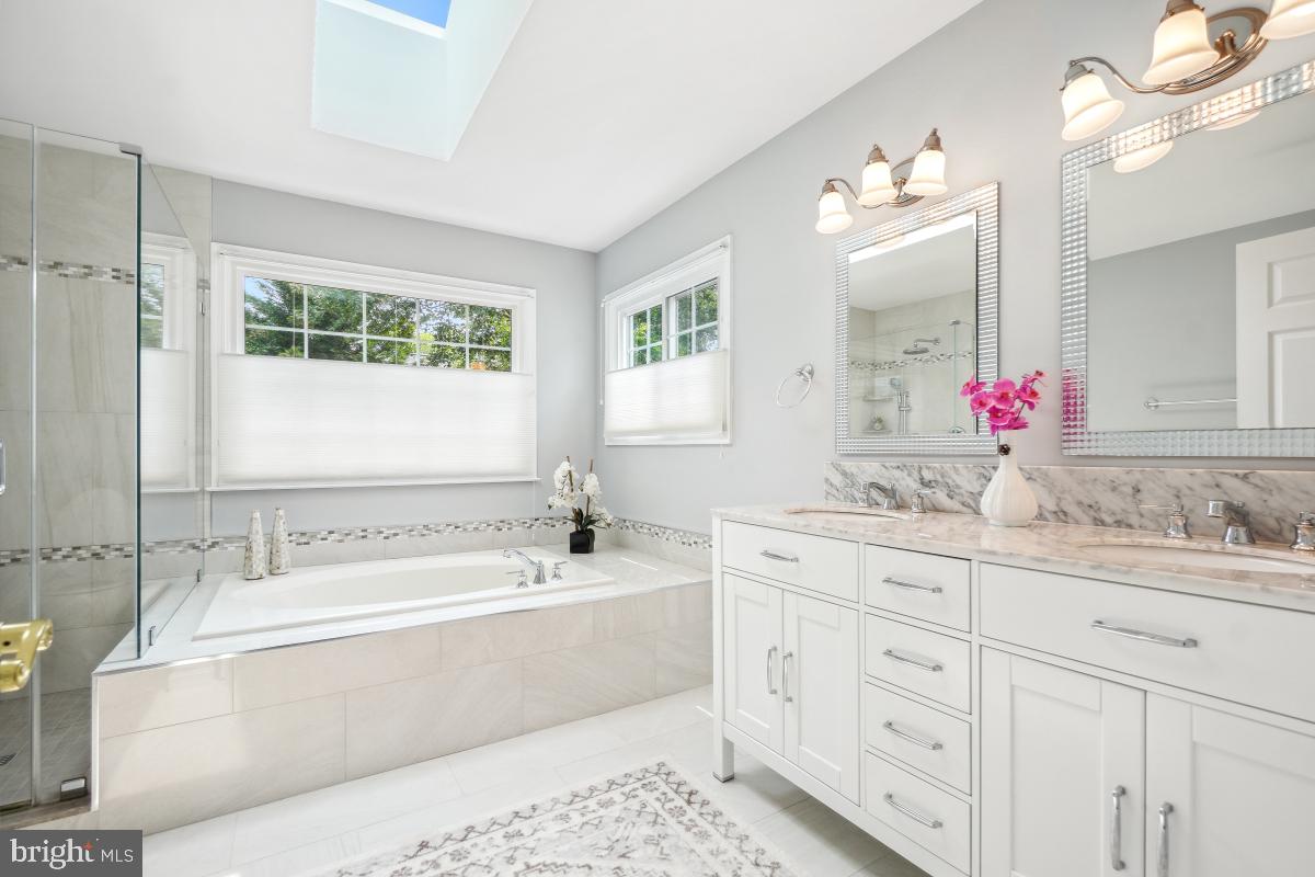 20479 Quarterpath Trace Circle Sterling, VA 20165 - Photo 27 of 41 a bathroom with a tub sink and mirror