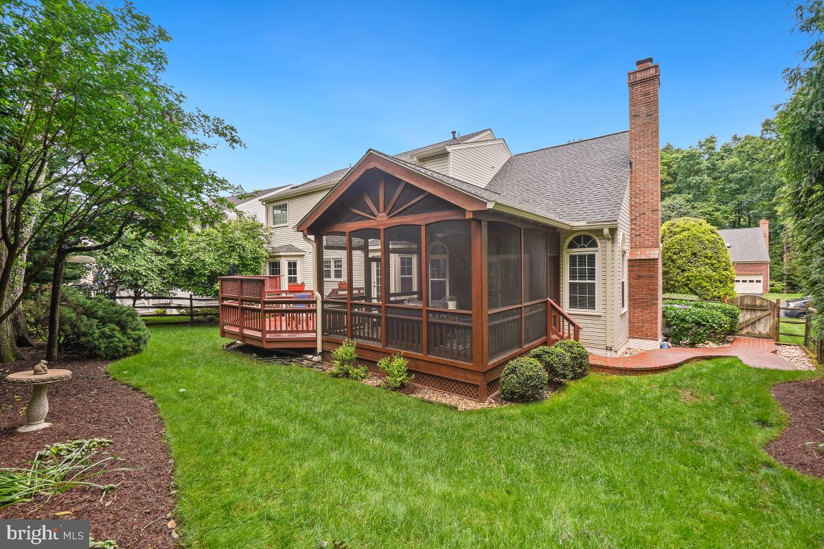 20479 Quarterpath Trace Circle Sterling, VA 20165 - Photo 40 of 41 a view of a house with a yard and deck
