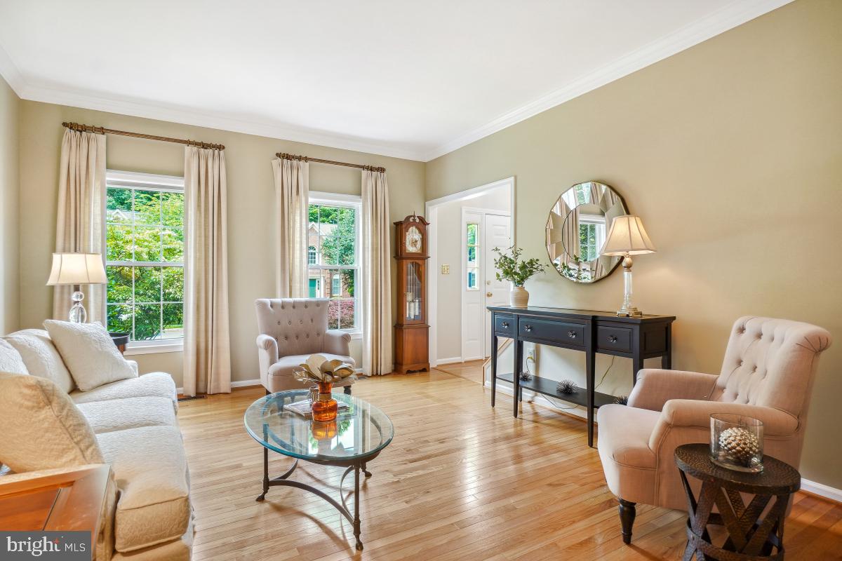 20479 Quarterpath Trace Circle Sterling, VA 20165 - Photo 10 of 41 a living room with furniture chess table and a large window