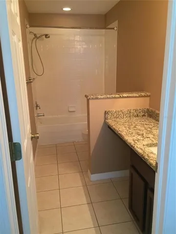 an empty room with a bathroom