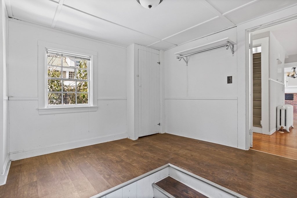 1900 Massachusetts Avenue Lexington, MA 02421 - Photo 11 of 15 a view of a livingroom with wooden floor and cabinet