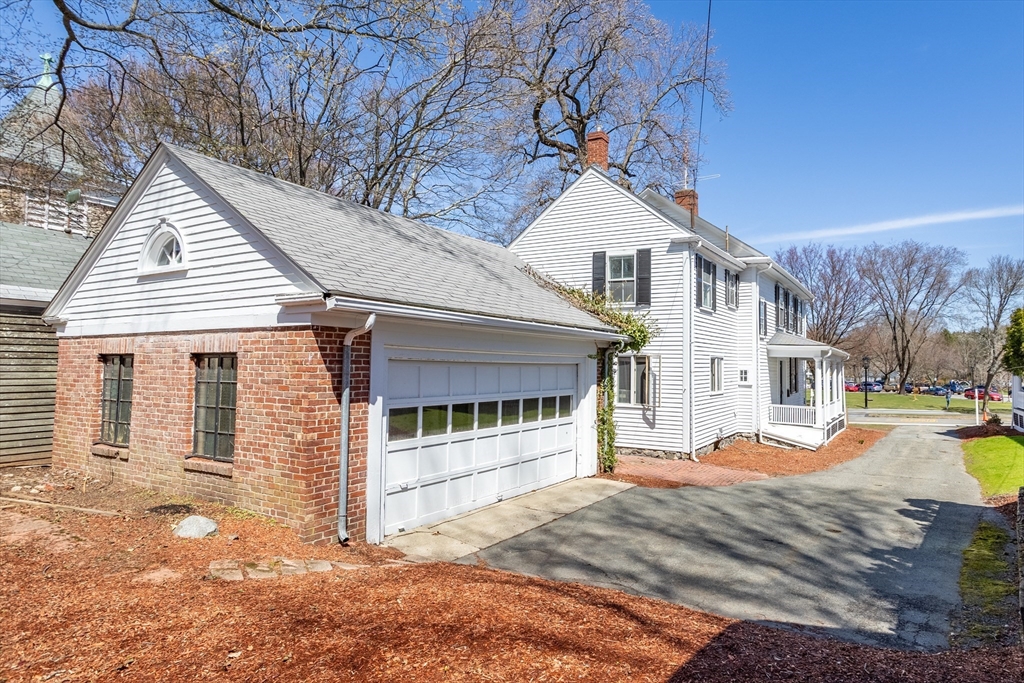 1900 Massachusetts Avenue Lexington, MA 02421 - Photo 13 of 15 a view of a white house with a large tree