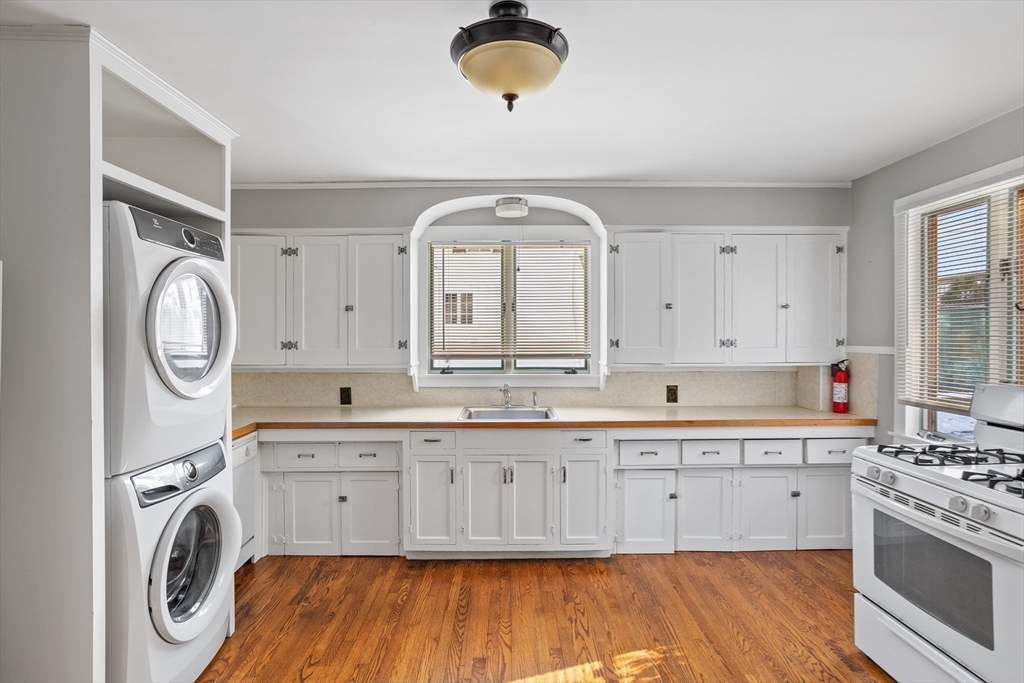 1900 Massachusetts Avenue Lexington, MA 02421 - Photo 7 of 15 a view of a kitchen with cabinets stainless steel appliances and a window