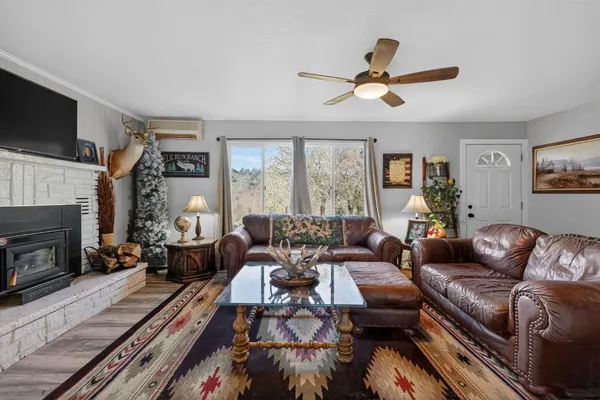 a living room with furniture fireplace and a flat screen tv