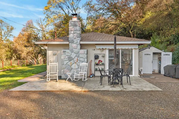 a table and chairs in front of house