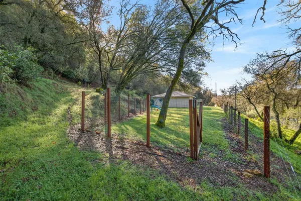 a view of a house with a yard and garage