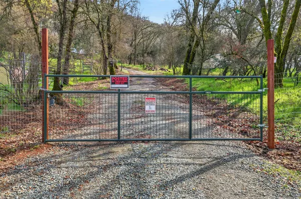 a view of a backyard with swimming pool