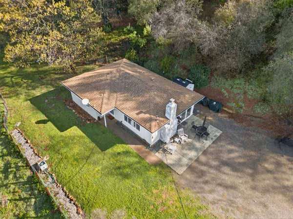 an aerial view of a house with swimming pool