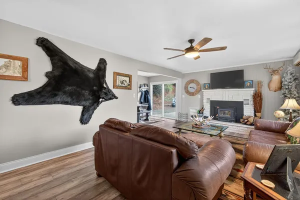 a living room with furniture fireplace and a flat screen tv