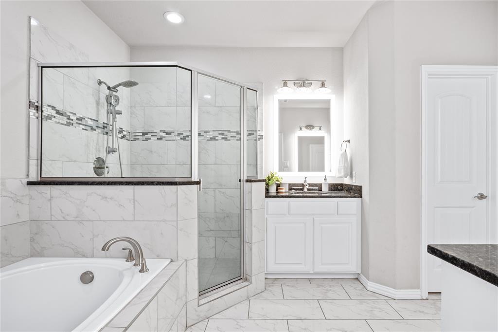 2205 Eriksson Lane Dallas, TX 75204 - Photo 12 of 18 a bathroom with a bathtub and shower