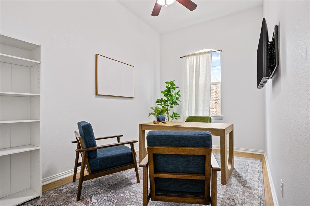 2205 Eriksson Lane Dallas, TX 75204 - Photo 14 of 18 a view of a workspace with furniture and a window