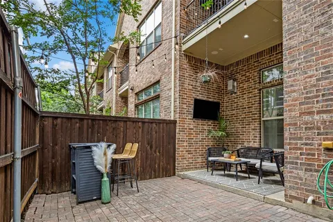 a front view of a house with outdoor seating