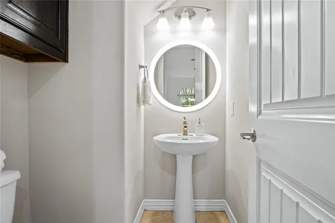 a close view of a sink in a bathroom with mirror