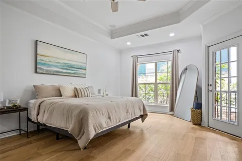 a spacious bedroom with a large bed and a large window