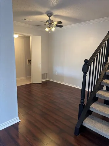 wooden floor in an empty room with a mirror