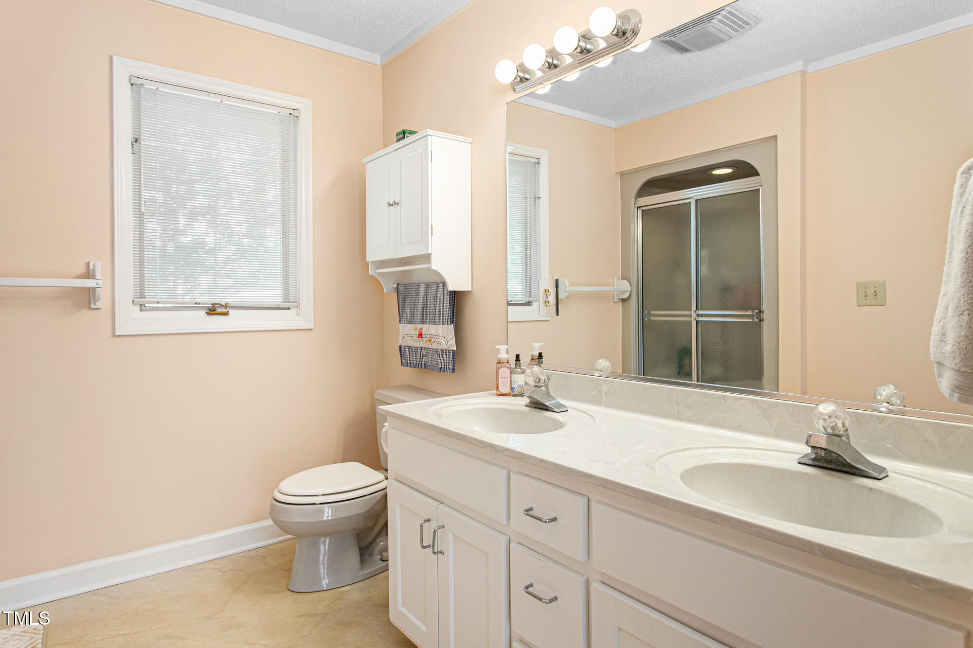 809 Brookview Drive Elon, NC 27244 - Photo 22 of 53 a bathroom with a granite countertop sink toilet and shower
