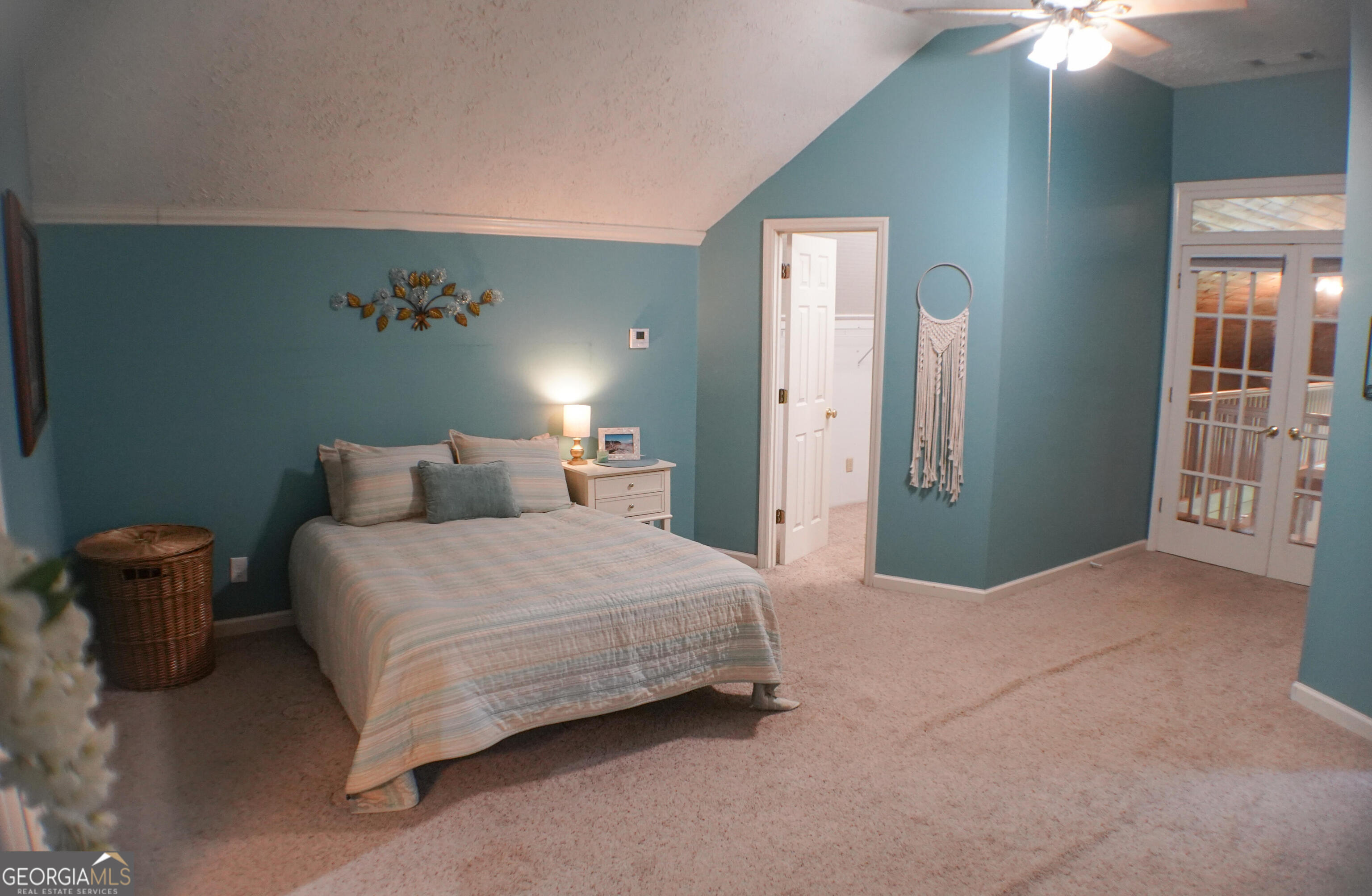 335 Winding Stream Trail Hampton, GA 30228 - Photo 23 of 35 a bedroom with a bed and a potted plant
